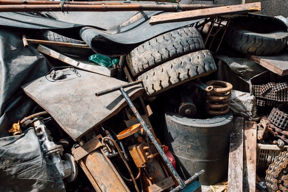 A pile of scrap metal and tires, awaiting removal by a professional junk hauling service in the Bay Area.