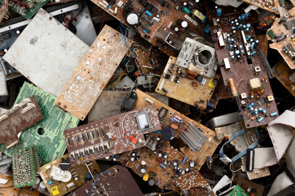 A pile of discarded electronic components awaiting junk removal in the bay area.